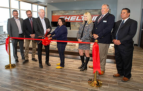 The official ribbon cutting. From left to right: Paul Anslow, Craig Foster, Jerry Holland, Libby Szabo, Lisa Holland, Todd Anderson, Tom Craft | Photo: Bob Beresh.